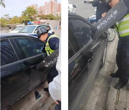 婴儿被反锁车内 民警用盾破窗救出.jpg 婴儿被反锁车内 民警用盾破窗救出.jpg